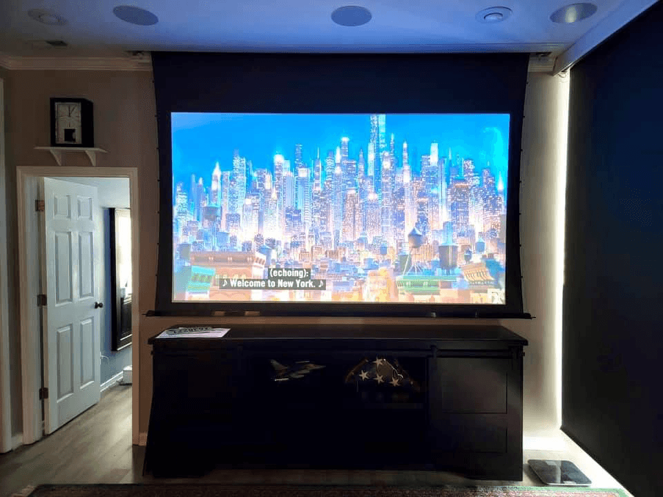 Home theater with projector screen, ambient LED backlighting, and in-ceiling speakers