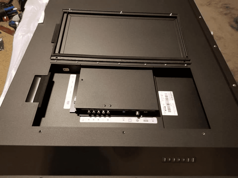 Outdoor TV mount hardware and media box on back panel