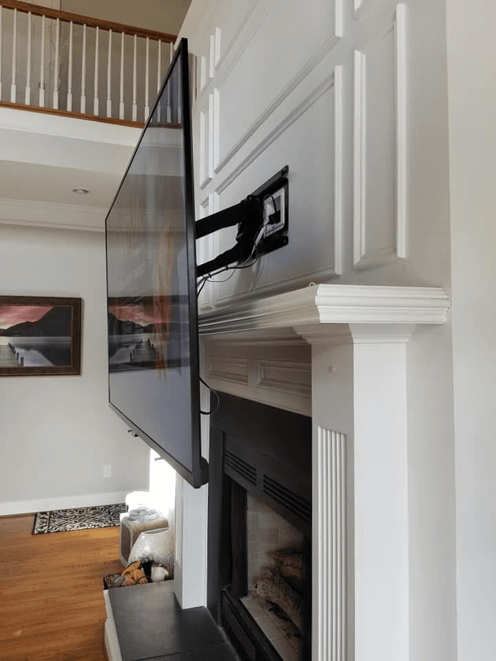 Full-motion TV mount extended from wall showing arm hardware detail